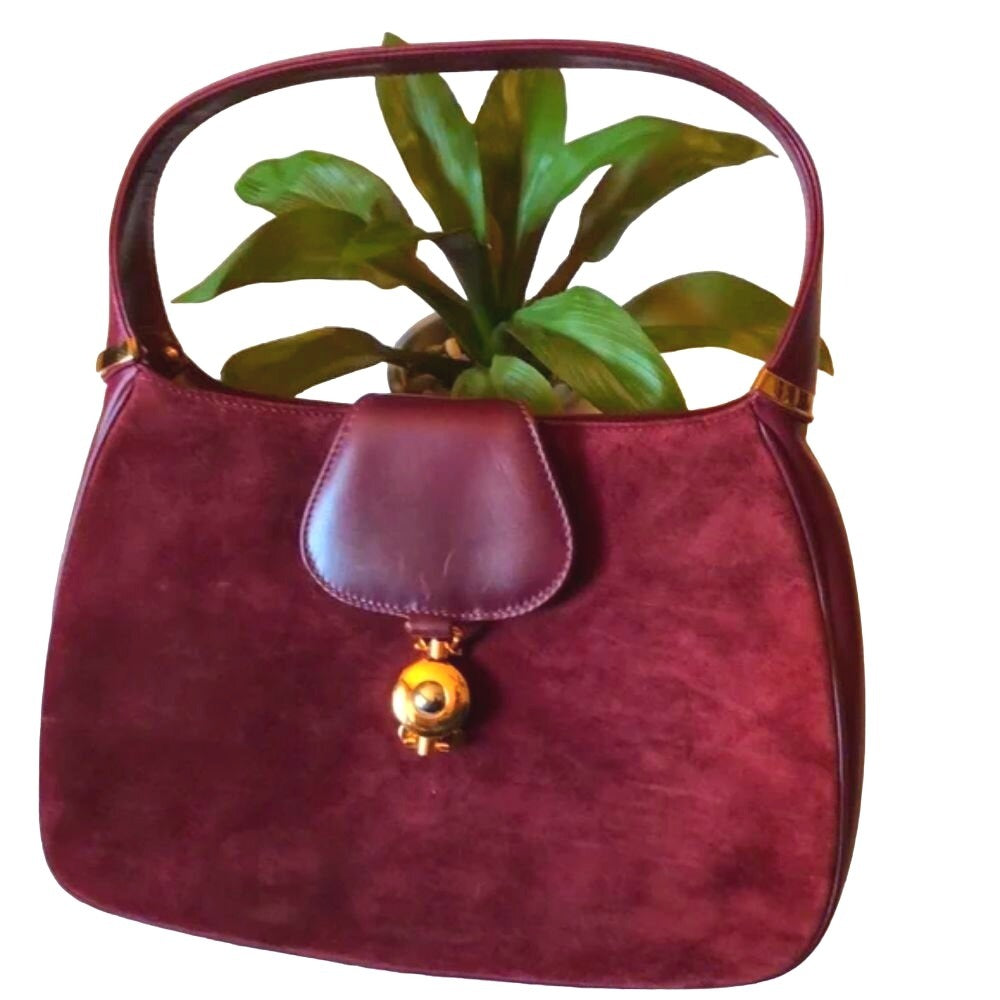 Rare, vintage, Gucci, burgundy leather & suede, unique, 1961 Jackie, hobo style shoulder bag with a two-tone piston closure & flap top