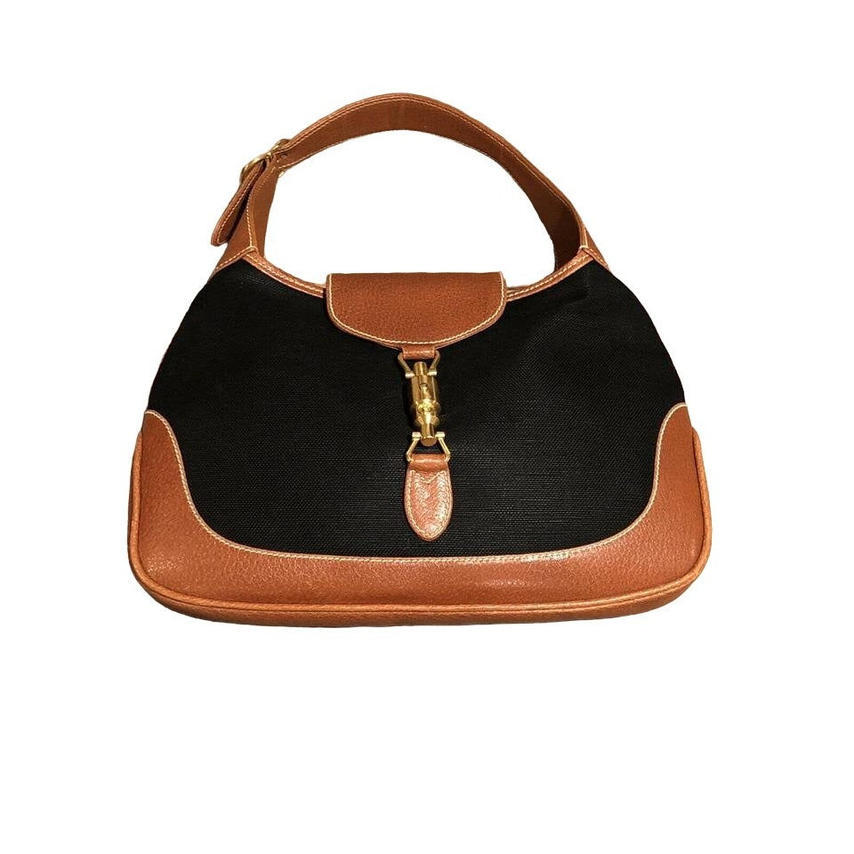 Original Gucci, 1961 Jackie hobo style shoulder bag, made in black linen canvas & camel leather with a gold piston closure & extender strap