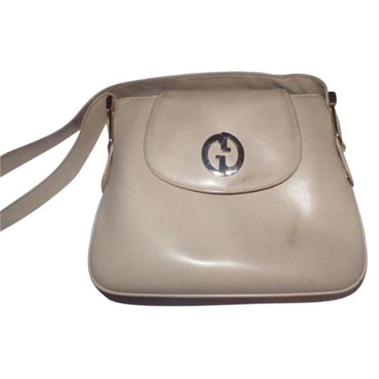 Vintage mod, Gucci, ivory leather 1973 shoulder bag with a gold GG flap snap closure & lots of room