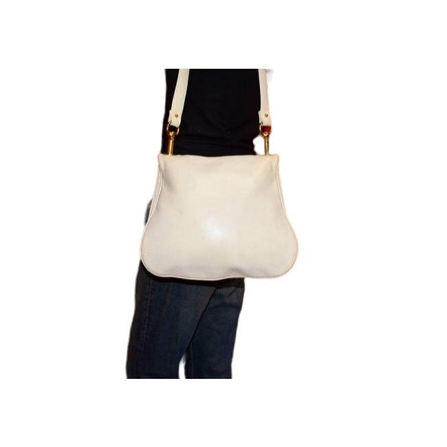 Vintage 1970s Gucci white textured leather Blondie style saddle bag with XL gold GG logo cutout in mint condition