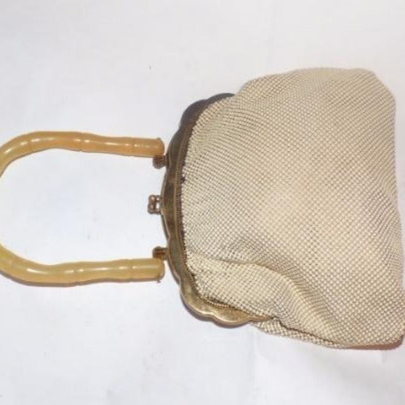 Art Deco, Whiting and Davis, cream enamel mesh purse with a carved bamboo look, translucent apple juice Bakelite handle