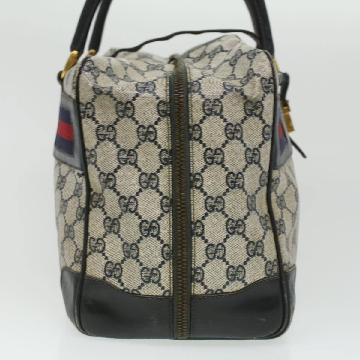 Very unusual, Gucci, blue Guccissima print & navy leather with wide red and blue striped corners, a footed bottom, dual zip closure top