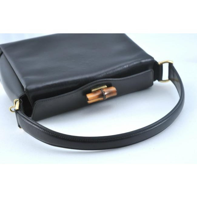 Tom Ford era, Gucci, midnight blue leather, roomy, Bamboo line, two-way top-handle shoulder purse with a bamboo clasp, gold tone hardware, a snap top closure, and a removable strap