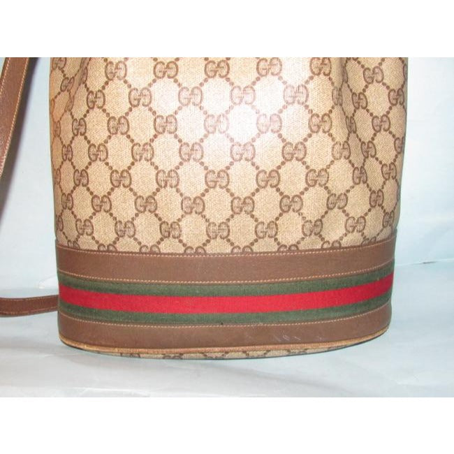 Gucci brown Guccissima print coated canvas & brown leather drawstring top Bucket Bag w red & green striped bottom