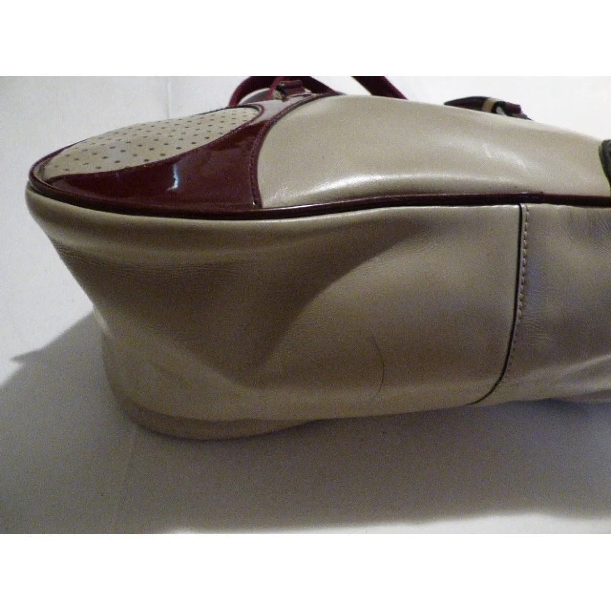 Vintage, 1990s Prada, light taupe leather and burgundy and black patent leather, satchel/ bowling bag style purse in a kidney shape