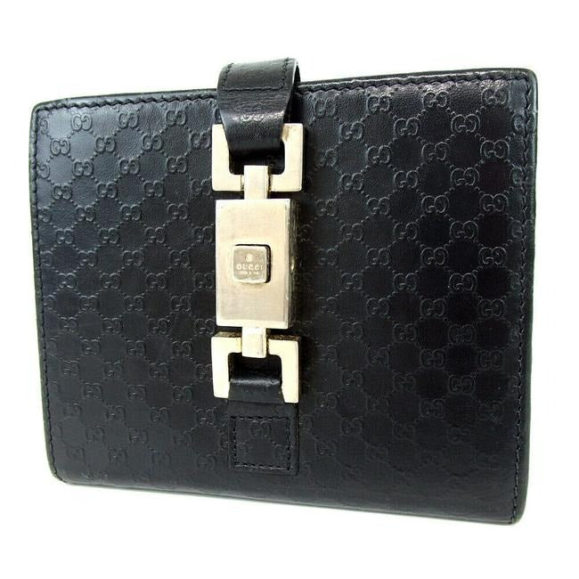 OUR MOST LIKED WALLET! Gucci, Jackie style, black micro Guccissima print leather, bi-fold wallet with chrome, Jackie style, push button closure, chrome accents, and lots of slots for your cards!