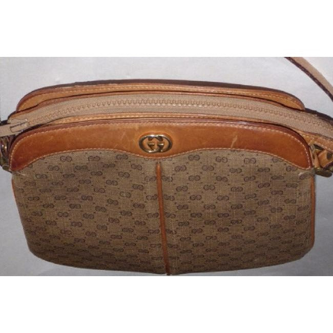 Gucci, brown micro Guccissima print coated canvas and camel leather cross body or shoulder bag with a zip top closure