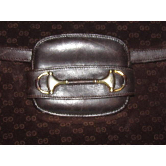 RARE, Gucci, mod, 1955 Horse-bit, dark brown micro Guccissima print embossed suede and leather shoulder bag with an envelope top, two strap lengths, and bold gold horse bit accents