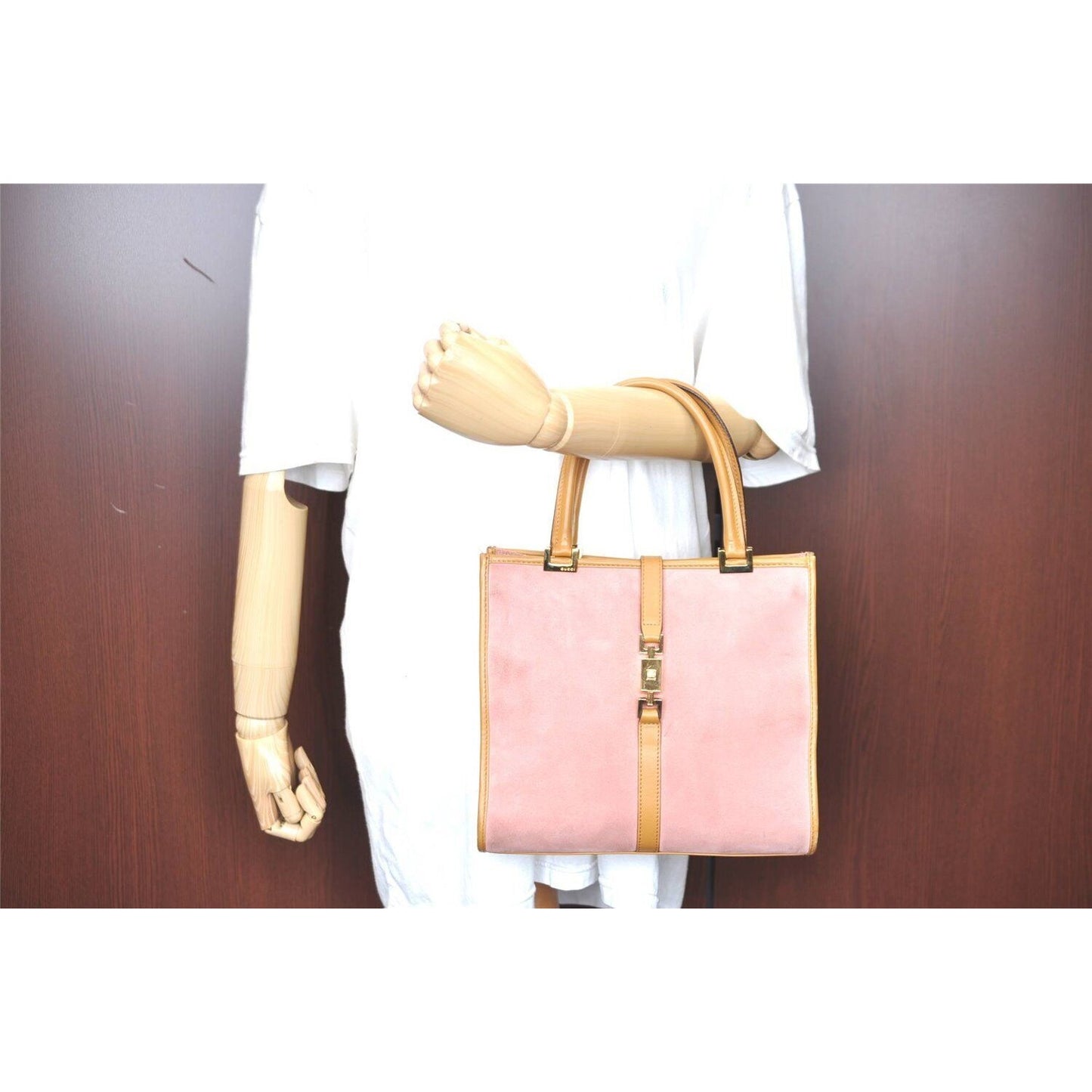 Gucci, pink suede and camel leather, Jackie bag with two, rolled leather handles, a chrome, push button closure and flip top closure