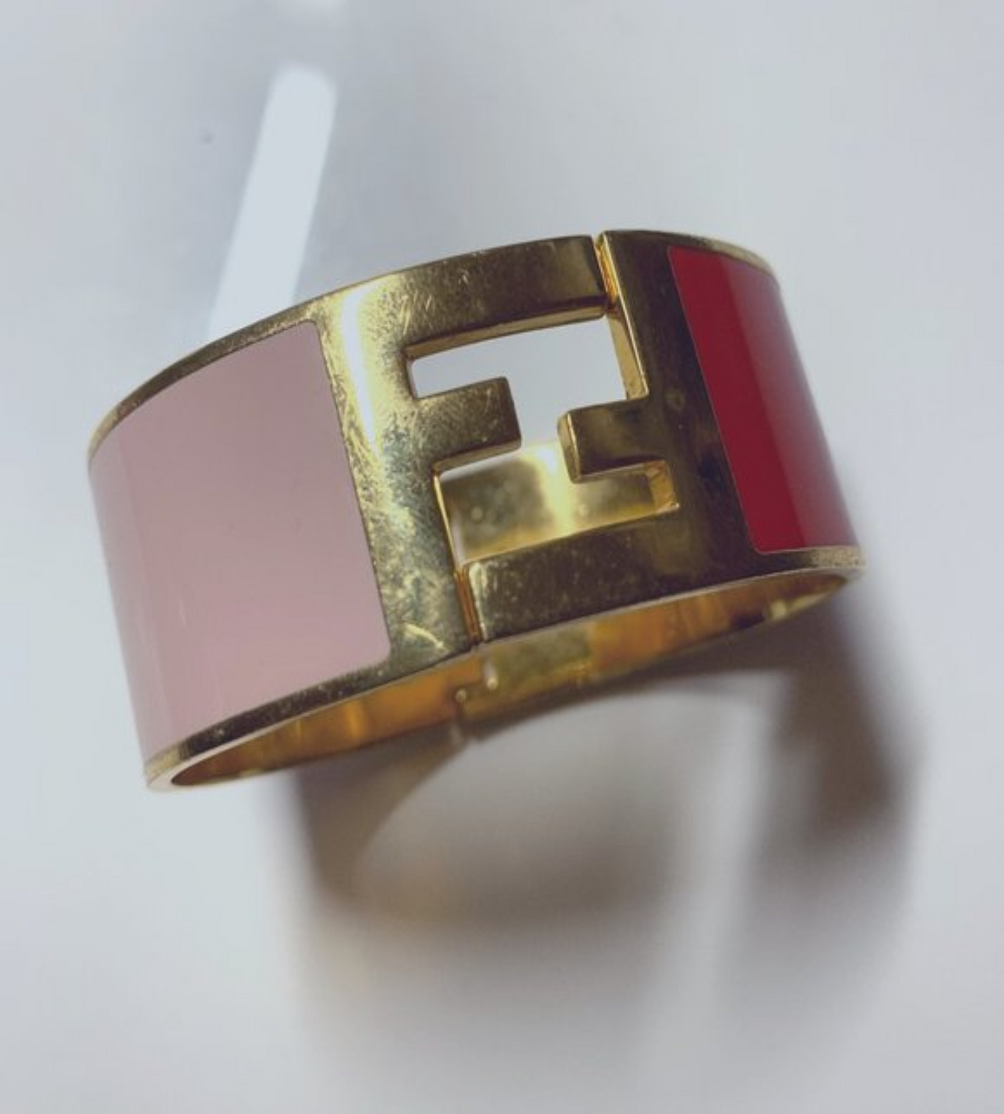 Fendi, substantial, enamel and gold clamper style bangle bracelet in pink & red with a large, 1" square, gold, 'FF' logo at the center