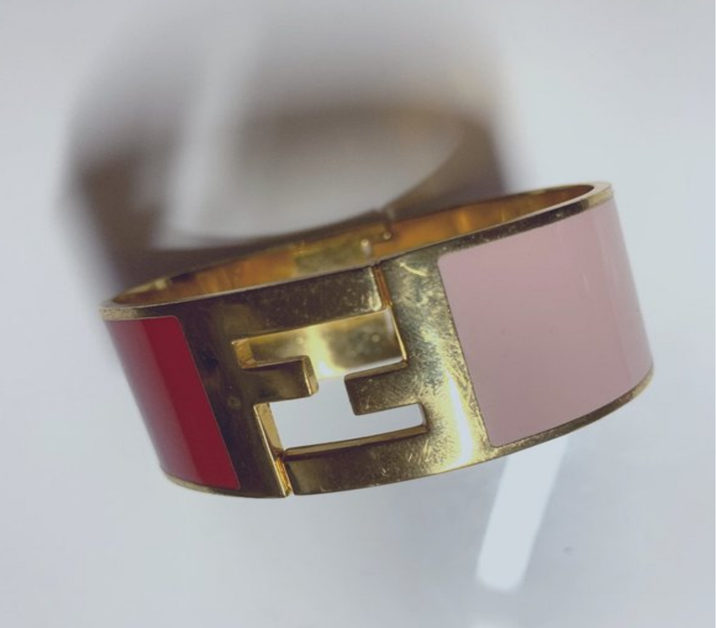 Fendi, substantial, enamel and gold clamper style bangle bracelet in pink & red with a large, 1" square, gold, 'FF' logo at the center